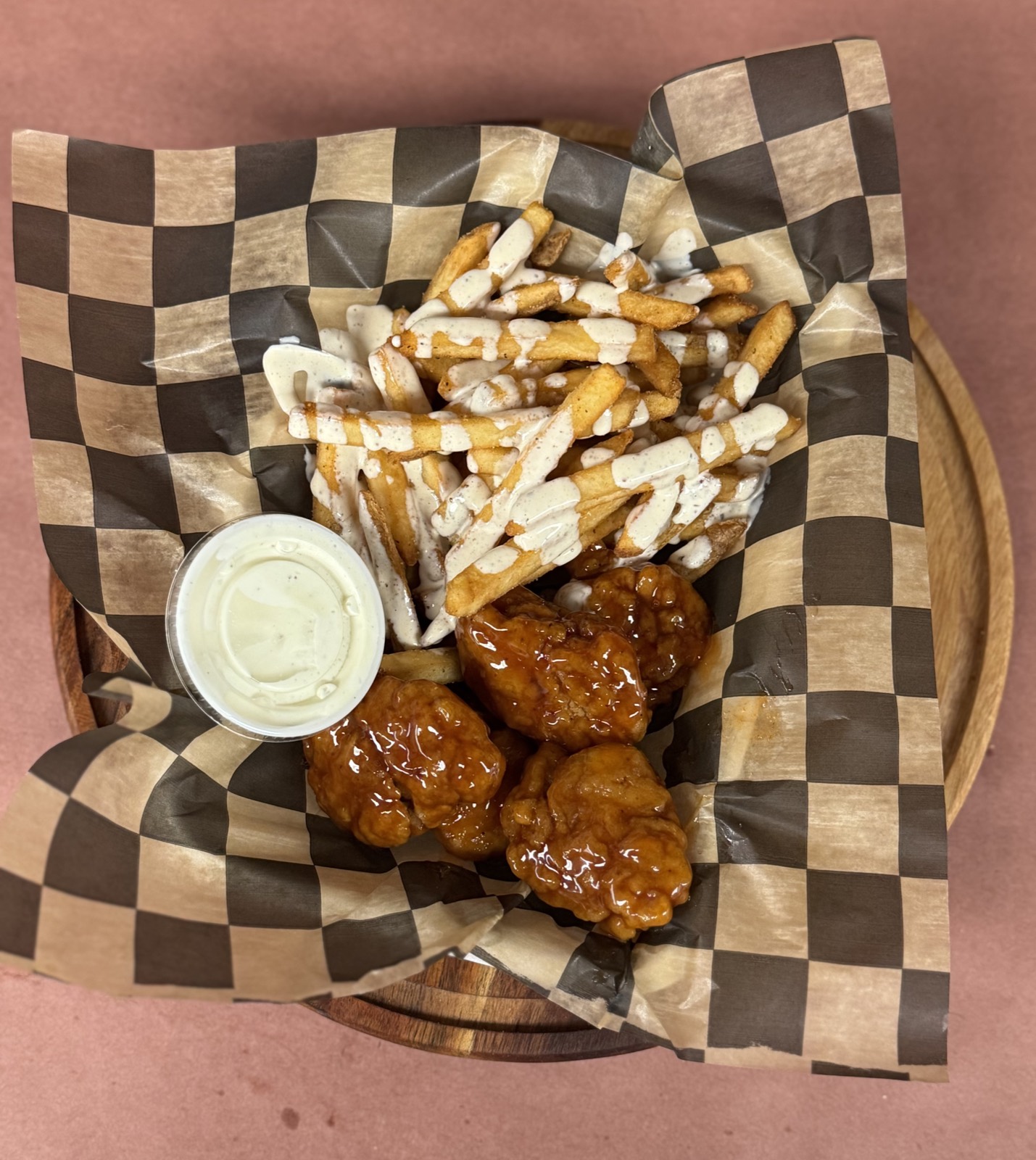 Saucy boneless wings with cajun ranch fries
