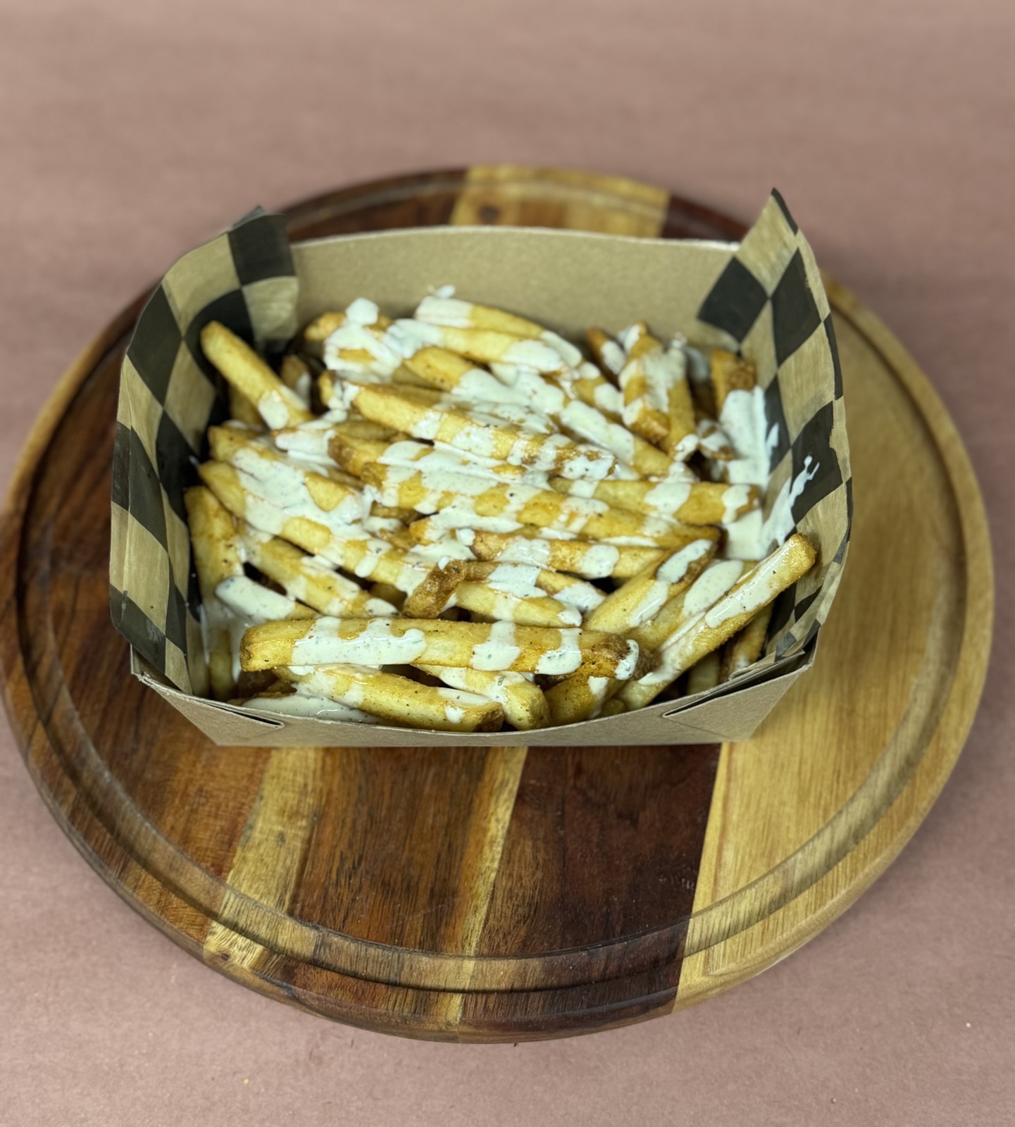 Seasoned fries drizzled with cajun ranch