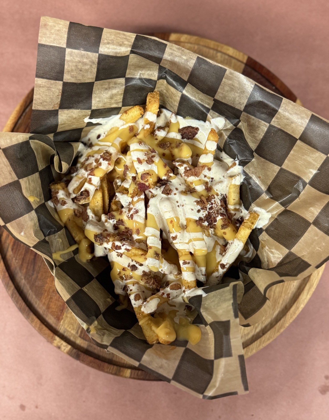 Loaded fries with nacho cheese, bacon, and ranch