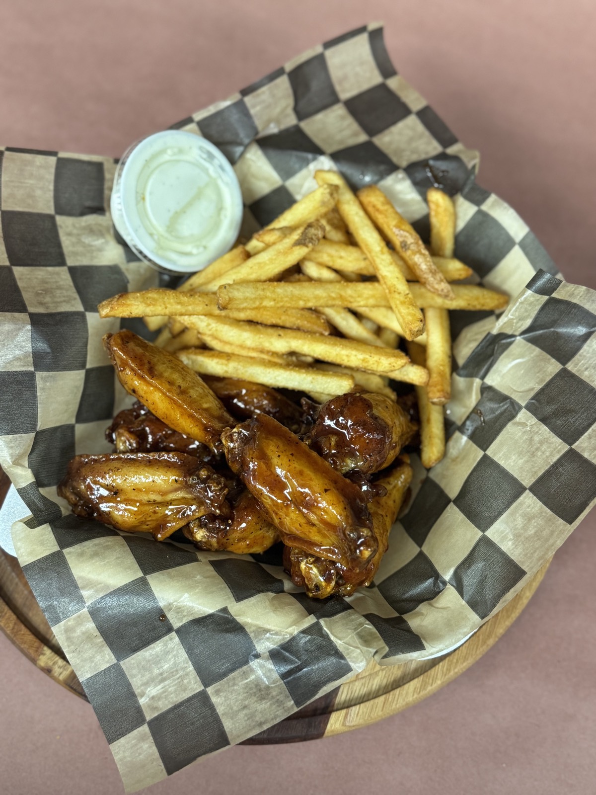 Honey BBQ glazed traditional wings with seasoned fries and ranch